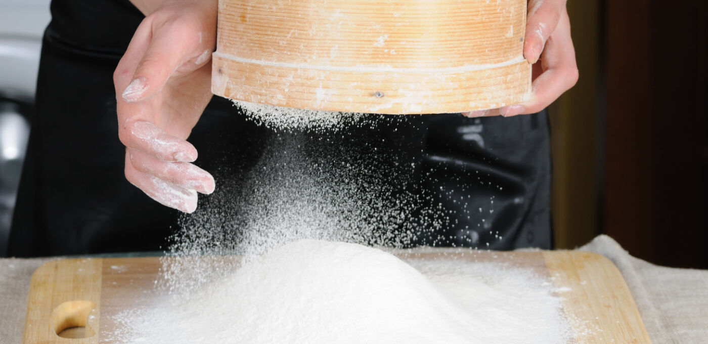 Flour sifting through a sieve banner